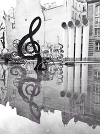 Building reflecting in water