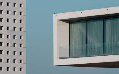 Low angle view of building against clear blue sky