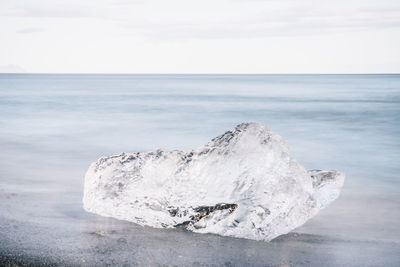 Scenic view of sea against sky during winter