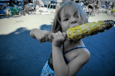 Portrait of girl eating food