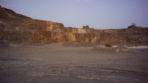 Rock formations in desert against sky