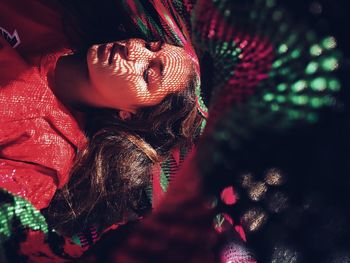 High angle view of young woman lying on hammock