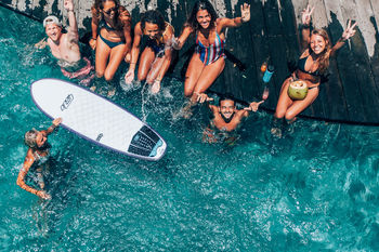 GROUP OF PEOPLE AT SWIMMING POOL