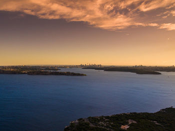 Scenic view of sea against sky at sunset