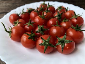 High angle view of tomatoes in plate on table