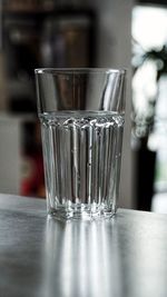 Close-up of glass of water on table