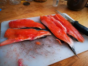 High angle view of wild trauth on cutting board