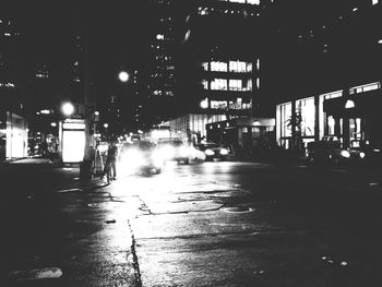 View of illuminated buildings in city at night