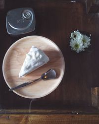 Close-up of white flowers on wooden table