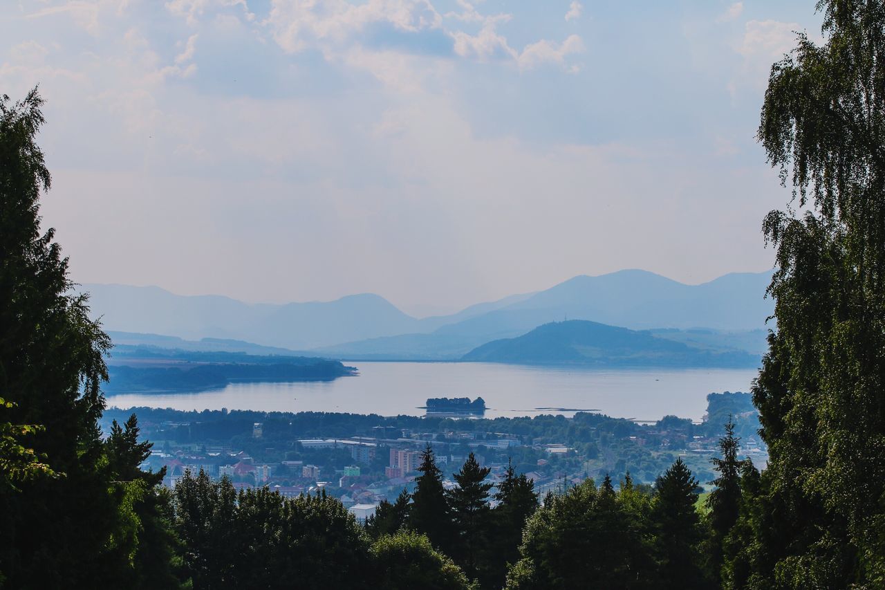 mountain, tree, scenics, tranquil scene, sky, mountain range, tranquility, water, beauty in nature, lake, nature, cloud - sky, idyllic, cloud, river, growth, outdoors, landscape, no people, silhouette