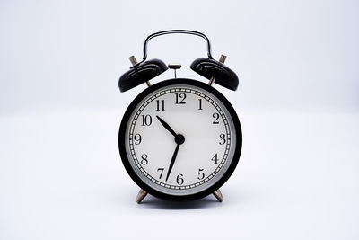 Close-up of clock on table