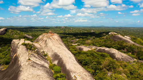 Aerial view of rocks among the rainforest and jungle against the sky and clouds. sri lanka, okanda.