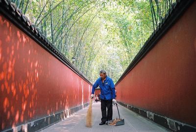 People sitting on footbridge