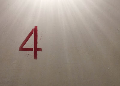 Red number four on the wall