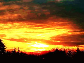 Scenic view of dramatic sky during sunset