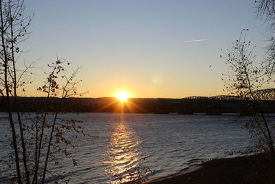 Scenic view of lake against sky during sunset