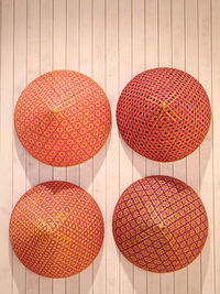 Close-up of fruits hanging against wall