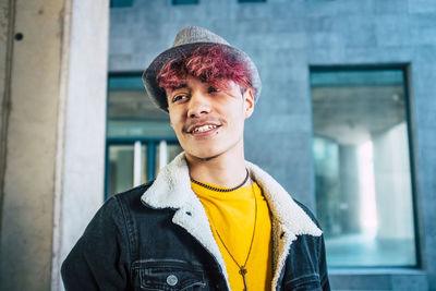 Portrait of young man standing outdoors