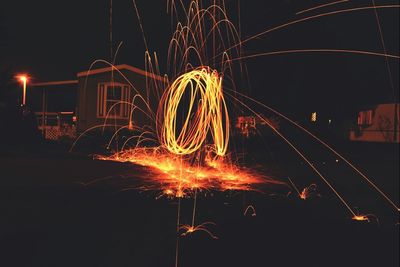 Firework display against clear sky at night