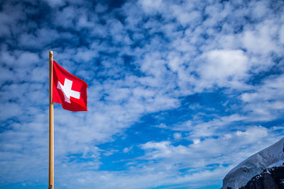 Low angle view of flag against sky