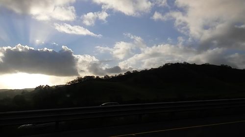 Scenic view of landscape against cloudy sky