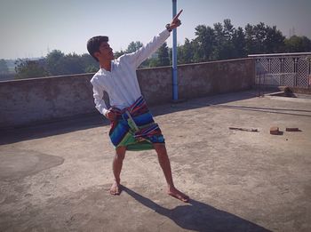 Full length of a boy playing on swing