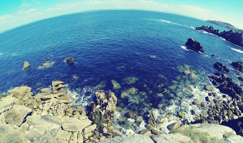 Scenic view of sea against blue sky