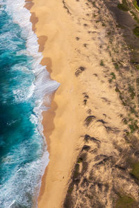 Aerial view of waves on beach