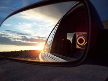 Reflection of car on side-view mirror