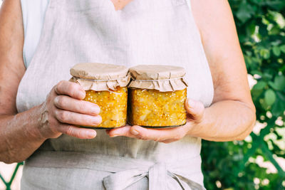 Midsection of man holding food