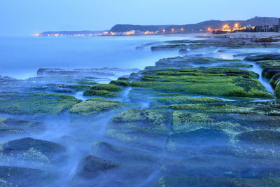 Scenic view of sea at dusk