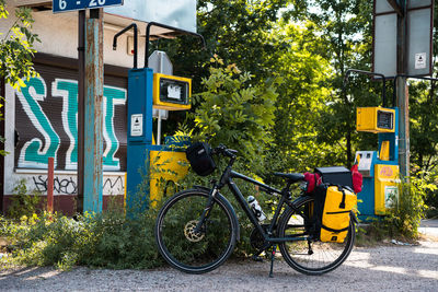 Tourist bike next to abandonet gass station