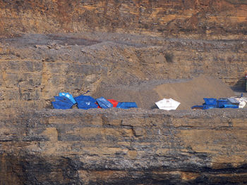 Garbage can on rock