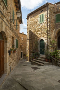 Alley amidst buildings in city