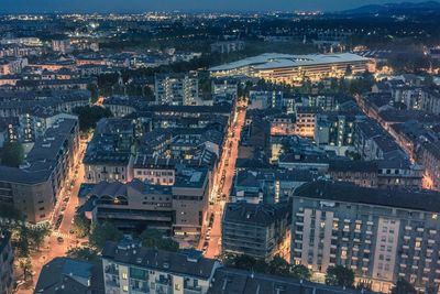 High angle view of illuminated buildings in city at night