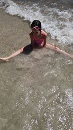 High angle portrait of woman on beach