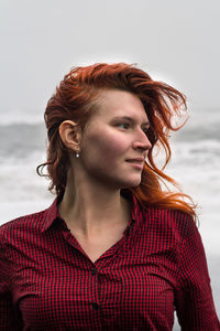 Close up attractive woman in red shirt outdoor portrait picture