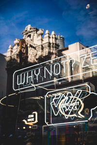 Low angle view of text on building