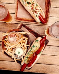 High angle view of hot dog on cutting board