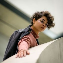 Portrait of fashionable young woman standing in city