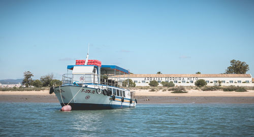 Ship in sea against clear sky