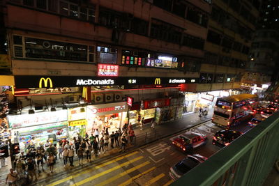 View of crowd in city at night