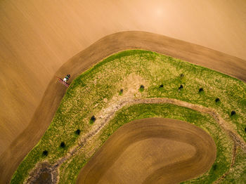 Aerial view of tractor on agricultural field