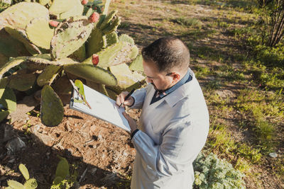 Side view of man working at farm