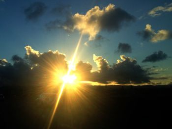Sun shining through clouds