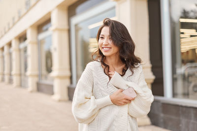 Young woman standing in city