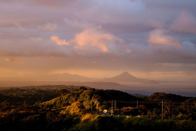 Scenic view of mountains against sky at sunset