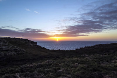 Scenic view of sea at sunset