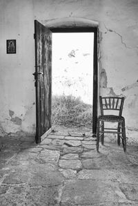 Empty chair in abandoned building