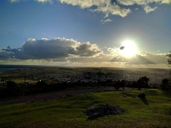 Scenic view of field against sky during sunset